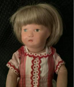 Schoenhut wooden toddler doll from 1919, 11 inches tall, an 11/107w on a walker body, with the Schoenhut label on her back (est. $1,000-$5,000).