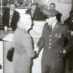 Then-Private Elvis Presley, in 1960, at a press conference in Germany, saying hello to Marion Keisker MacInnes, an Air Force Captain who, earlier at Sun Records, helped Elvis launch his career.