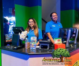 Visalia Adventure Park staff at ticket counter smiling