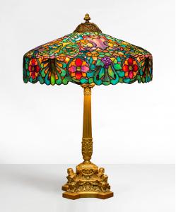 Fine and rare Duffner & Kimberly Italian Renaissance table lamp, circa 1906, leaded glass and patinaed bronze, 34 inches tall with a 24-inch shade, from the estate of Howard D. Booher Sr., of Atwater, Ohio (est. $40,000-$60,000).
