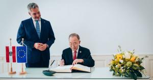 BKMC Co-chair Ban Ki-moon signing guest book with Austrian Chancellor Karl Nehammer
