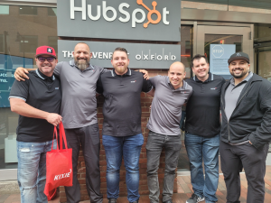 Representatives from Kixie pose for a group picture outside HubSpot HQ