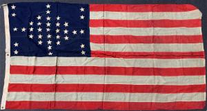 Rare American flag with 37 stars, showing an interesting star pattern and in very good condition, made sometime in 1867 upon the admission of Nebraska as a state ($10,625).