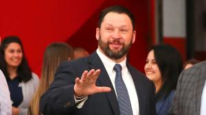 Photo of Andrew Goodrich in action waving hand