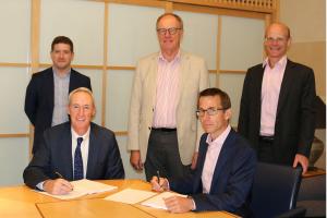 Members of TTV Ventus and The Lee Company signing the acquistion