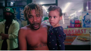 A clip of a scene with Nizzle Man in his latest music video for single "Fallen"