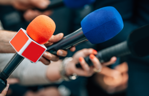 NewsXPartners Image of reporter microphones