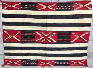 Beautiful, circa 1900 red Mesa Chief pattern rug, 6 feet by 6 feet 5 inches, in generally good condition with no major defects (est. $5,000-$7,000).