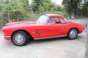 1962 Roman Red convertible Corvette with hard top, fully restored.