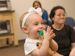 young child smiling at St Tammany Parenting Center