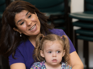 St Tammany PC staff with child on their lap