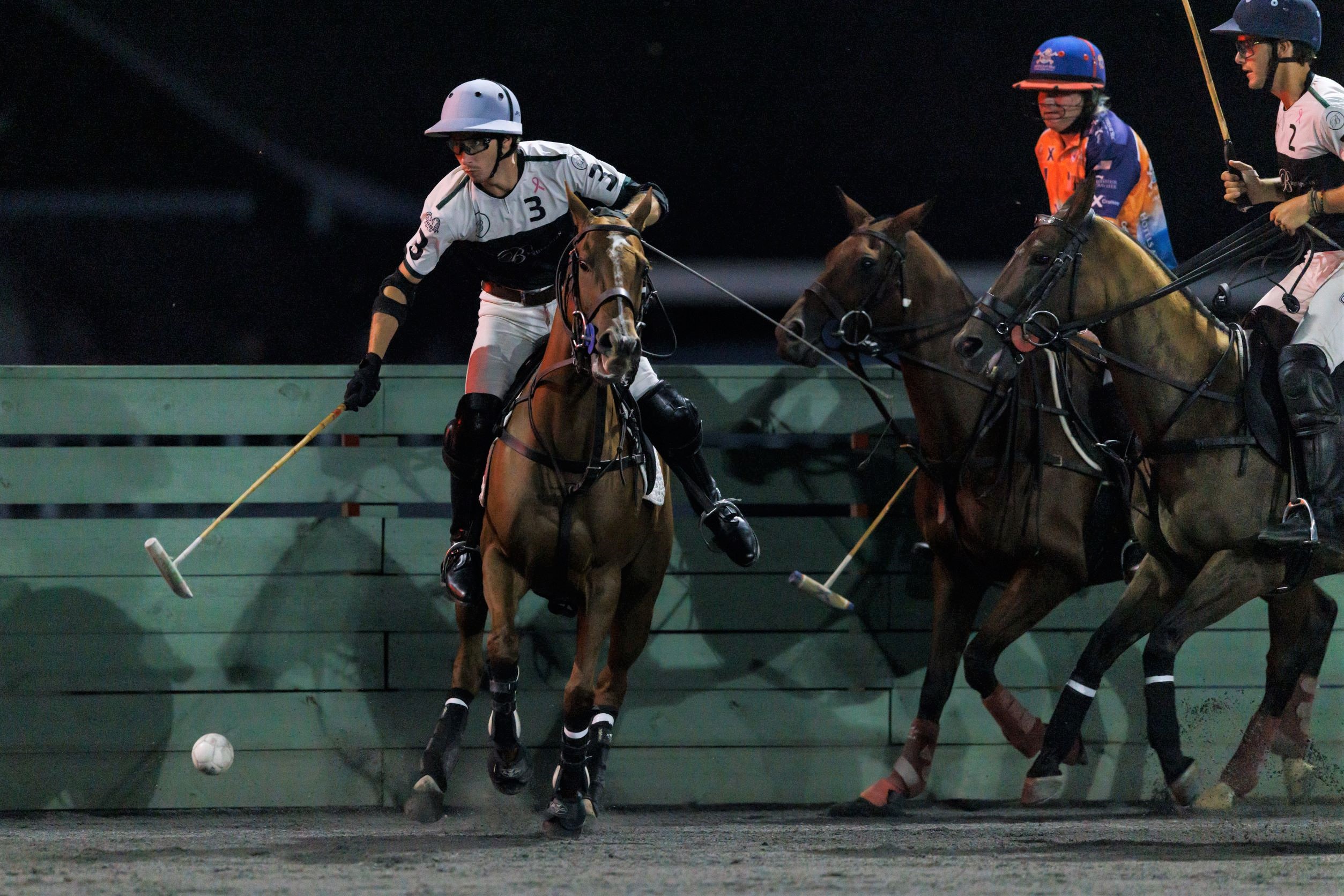 arena polo player chases the ball in United States Polo Association US Open Arena Polo Championship