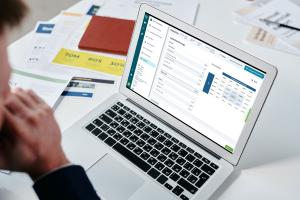 Laptop showing Valutico's Valuation Platform on table