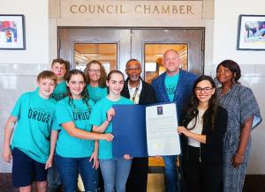Drug-Free World volunteers with their acknowledgment from KC City Council