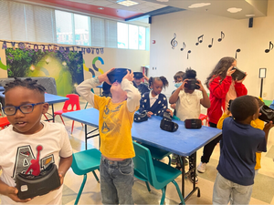kids standing up and interacting in activity held by High Point Library