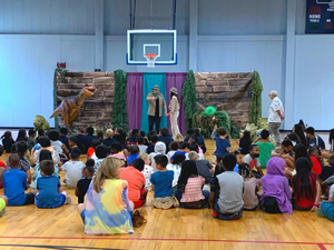 High Point Library putting on a play for kids - actors on stag