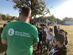 Texas Trees Foundation volunteer with students