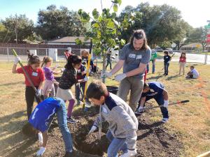 5th graders from Dallas ISD's Caillet Elementary plant trees together, with guidance from volunteers and Texas Trees Foundation's Urban Forestry team