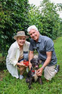 Kona Earth owners Steve and Joanie Wynn with Tickle, their rescue dog