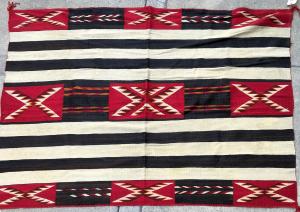 Beautiful circa 1900 red mesa chief pattern rug, 6 feet by 6 ½ feet ($4,000).