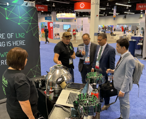 CFO stands in front of booth