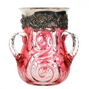 American Brilliant Cut Glass cranberry cut to clear loving cup, 7 inches tall, having a beautiful swirled snail design with engraved floral highlights, triple notched handles and hobstar base.