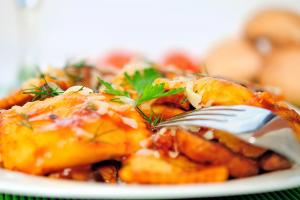 Roasted Paneer Ravioli in Tomato Cream Sauce at Feather Glass Wine Bar & Eatery