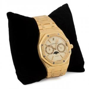 Audemars Piguet 18k yellow gold watch, model Royal Oak 1204, with an automatic movement, yellow dial, moonphase/date/day of week sub dials (est. $30,000-$50,000).