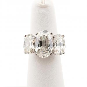 Three-stone platinum and 9.51-carat diamond ring, featuring two oval and one cushion-cut diamond (all three GIA-certified, with certificates) (est. $125,000-$175,000).