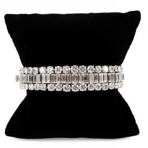 Diamond and 18k white gold bracelet, likely Continental, featuring graduated emerald cut and round brilliant cut diamonds weighing about 39 carats total (est. $70,000-$125,000).