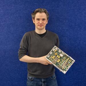 Alpha Data Senior Engineer David Dolman holding the Focal Plane Interface Electronics – Digital (FPIE-D)