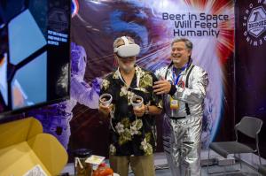 Charles Papazian dons a virtual reality headset to visit a brewery in space made possible by 7 Bridges Brewing Co through the use of metaverse and web3 technology