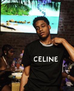 8FS Recording Artist Iffy Foreign wearing black celine shirt