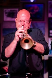 Photograph of Chip Herrington playing trumpet.