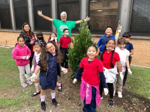 Tree plantings could not be possible without the support of our volunteers. One of our "regulars" having fun with L.O. Donald students.