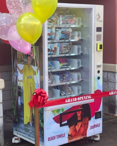 The new Flights in Stilettos® specialty vending machine located at Bowie Town Center carries Glam Girl beach towels and journals.