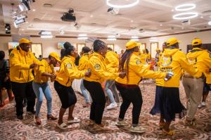 Educators dancing in celebration of their Tools For life graduation.