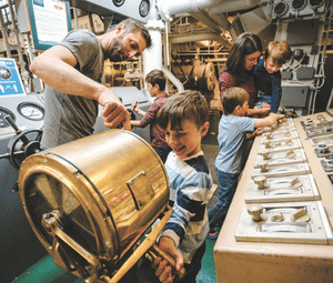 Family interacting in museum in Toledo
