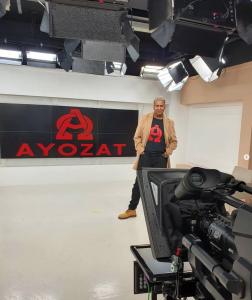 Male owner Ayozat standing in studio