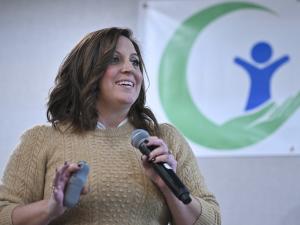 Woman presenting with microphone