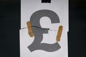 Torn pound sign with plasters attaching the two sides