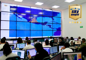 A room of security agents work in front of a large computerized map to track vehicle fleets within GpsGate's software