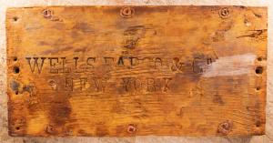 One of the many historic items recovered from the fabled “Ship of Gold,” the S.S. Central America that sank in 1857, is the lid to the oldest known Wells Fargo treasure shipment box. (Photo credit: Holabird Western Americana Collections.)