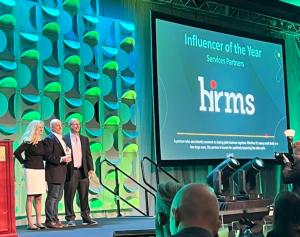 HRMS' Mike Maiorino holding Influencer award with UKG's Stephanie Allen and Mike Sorvillo
