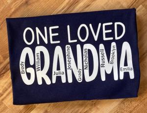Show your love with One Loved Grandma Short Sleeve T-shirt Graphic, a perfect gift for Grandma!