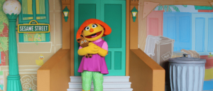 Sesame Place - Julia, autistic muppet on front stoop