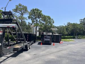 Three dumpsters side by side for construction and demolition of fire damage