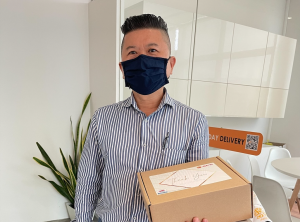 uParcel Agent Posing with an SPC Box