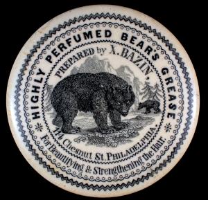 Classic American pot lid for X. Bazin Perfumed Grease, 3 ¼ inches diameter. Xavier Bazin was a French perfumer. This lid has a fancy border and is one of only five known (MB: $100).