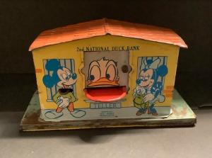 1950s Disney 2nd National Duck mechanical tin bank in good condition featuring Mickey, Minnie, Goofy, Donald, Pinocchio, Figaro, Huey, Dewey and Louie (est. $500-$1,000).